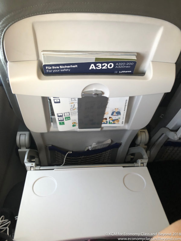 an airplane seat with a seat open