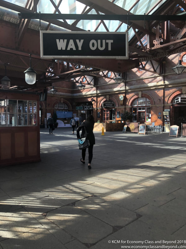 a woman walking in a train station