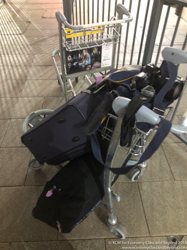 luggage on a cart with luggage