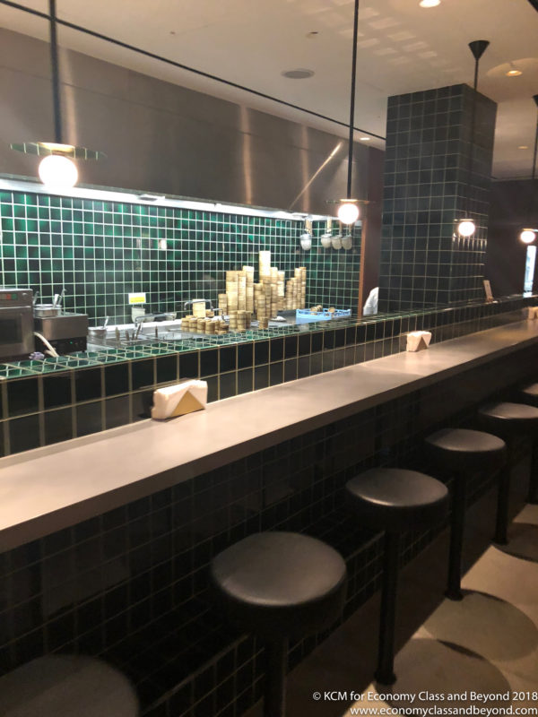 a bar with stools and a counter
