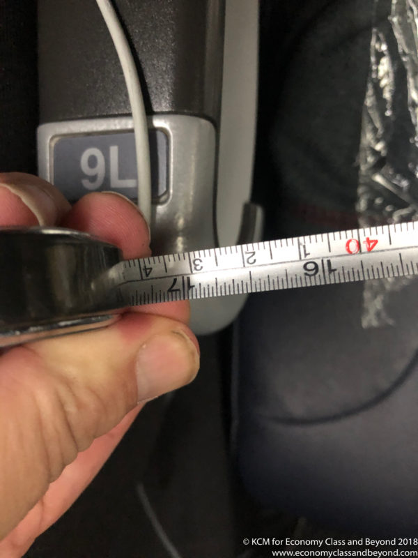a person holding a measuring tape
