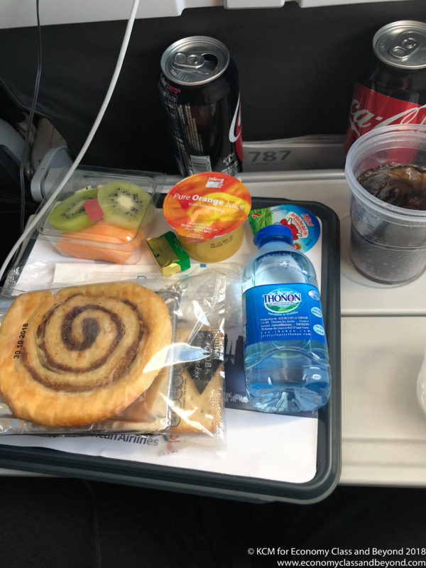food on a tray with drinks and beverages