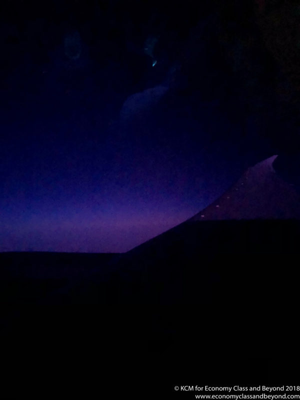 a mountain with a purple sky