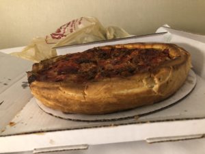 a deep dish pizza in a box