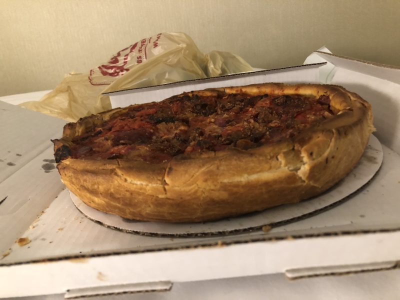 a deep dish pizza in a box