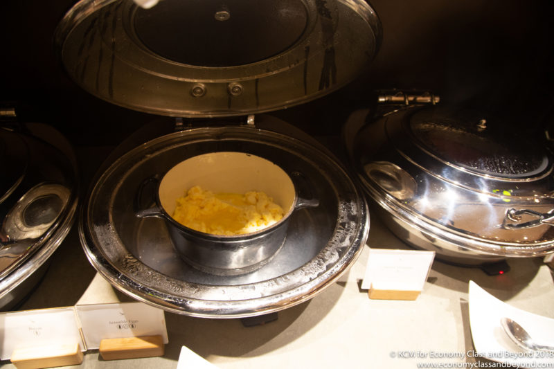 a pot of scrambled eggs in a pan