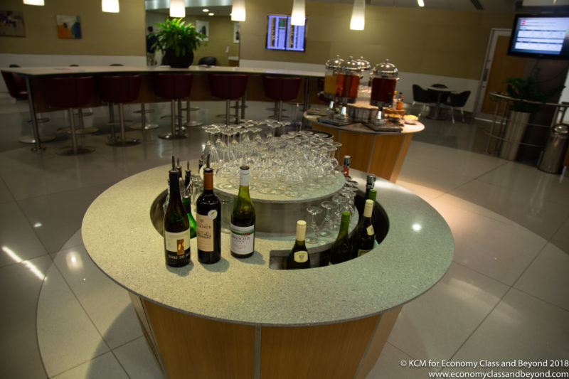 a table with wine glasses and bottles on it
