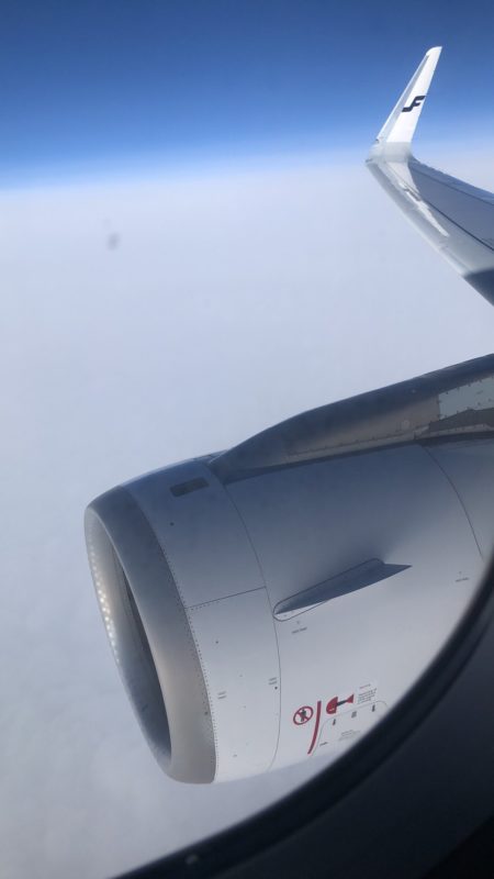 a plane wing with a jet engine