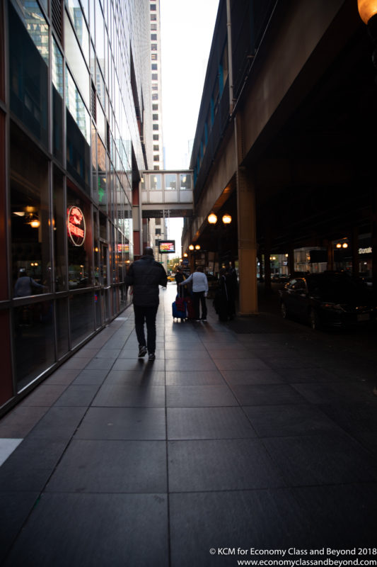 people walking on a sidewalk