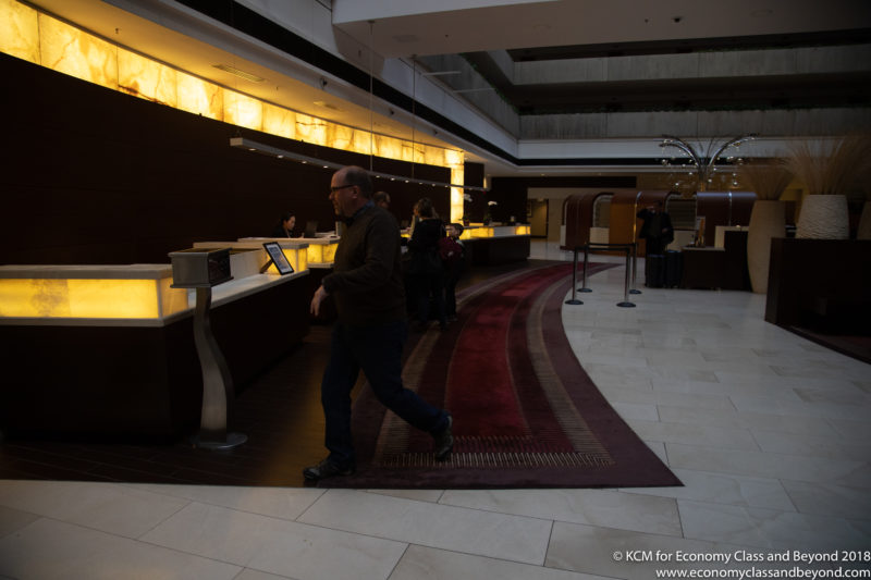 a man walking in a hotel lobby