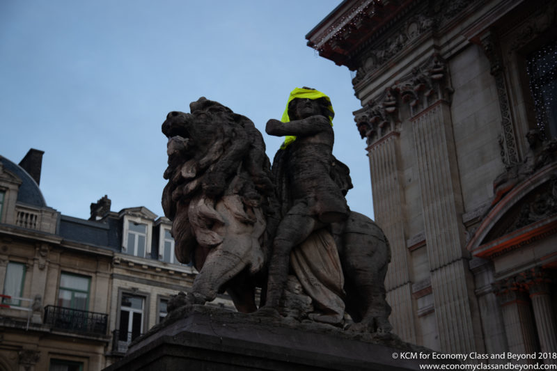 a statue of a man and a lion