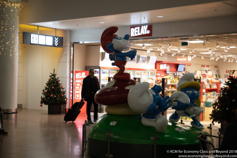 a statue of smurfs in a mall
