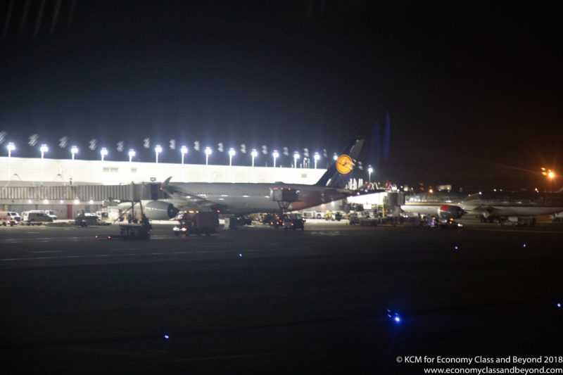 an airplane at an airport at night
