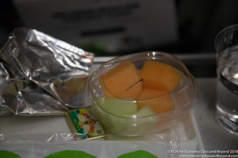 a plastic container with fruit in it