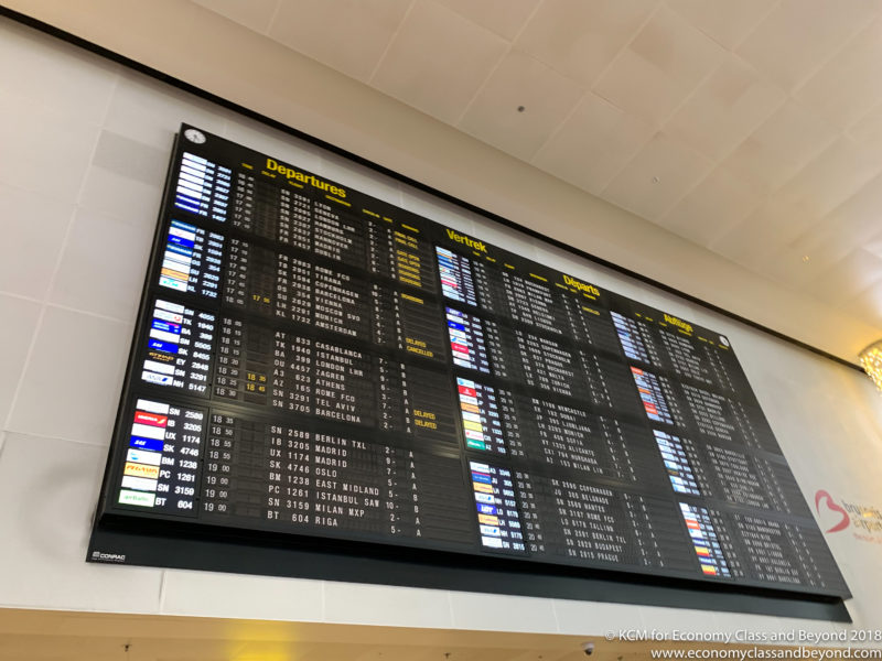 a screen with a number of departures on it