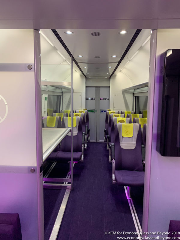 inside a train with purple seats
