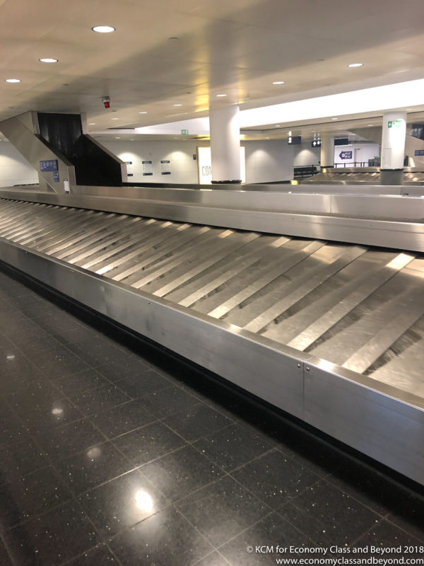 a luggage carousel in an airport