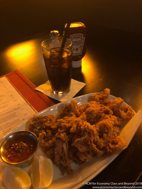 a plate of fried chicken and a drink