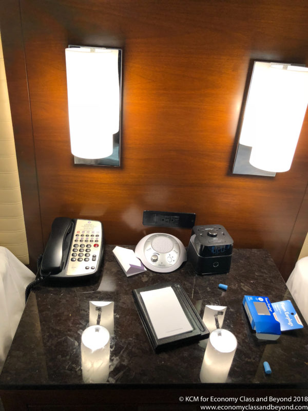 a desk with a telephone and other objects on it