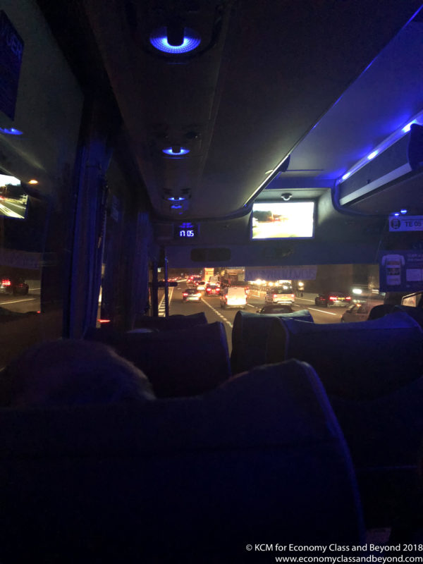 a view from inside of a bus at night