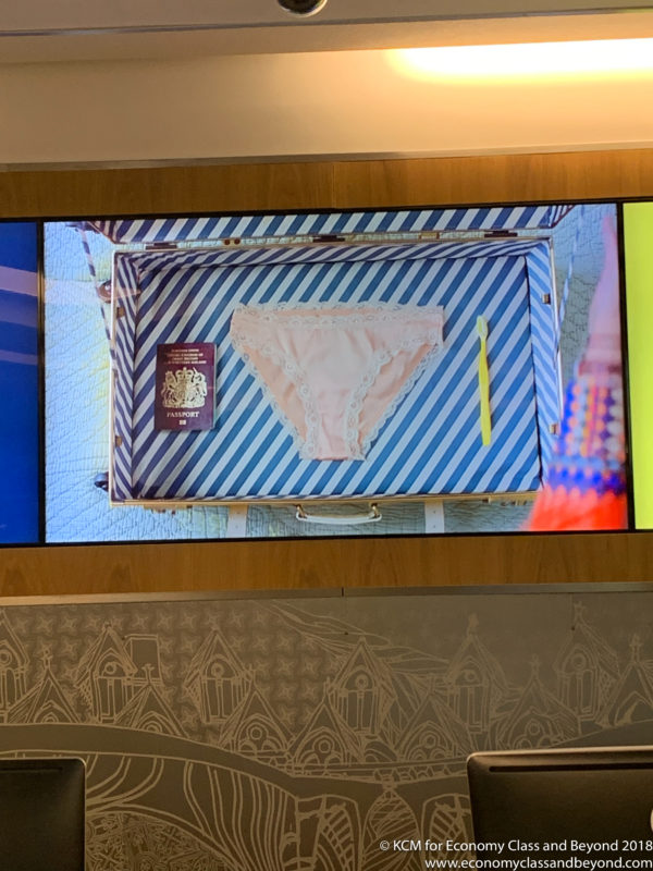a television screen showing a suitcase with underwear