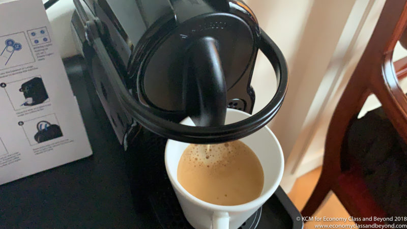 a coffee machine pouring a cup of coffee
