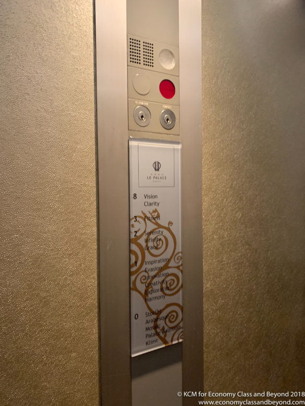 a elevator button on a wall