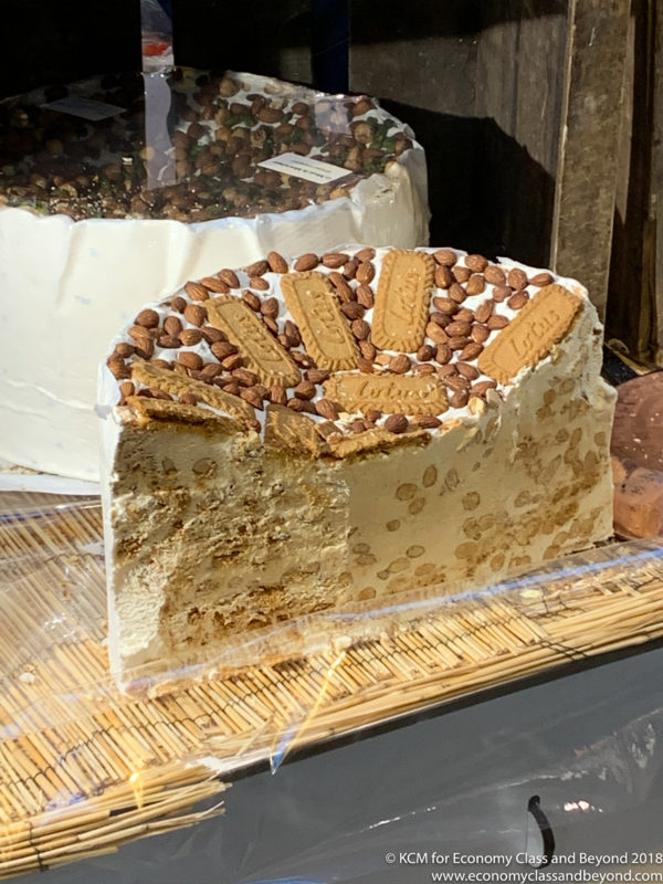 a large cake with nuts on top