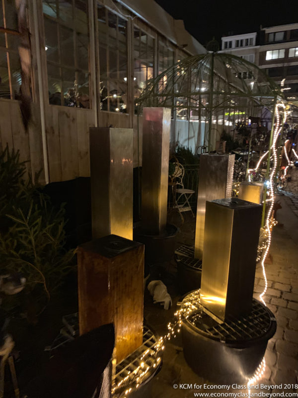 a group of metal pillars with lights on them