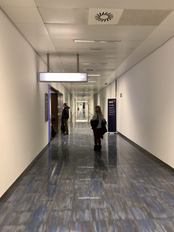 a woman standing in a hallway