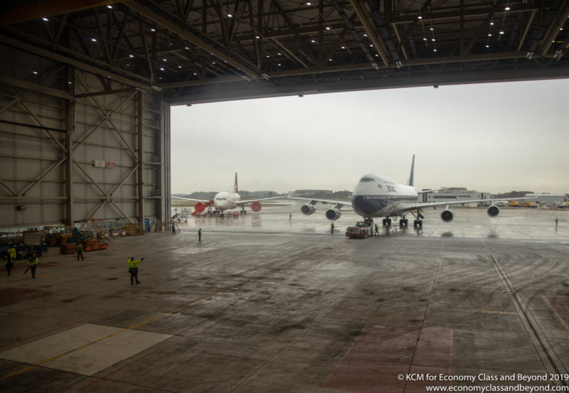 a large hangar with airplanes in it
