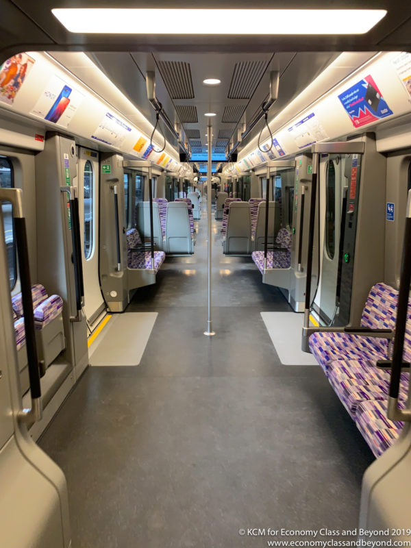 a train with seats and a pole