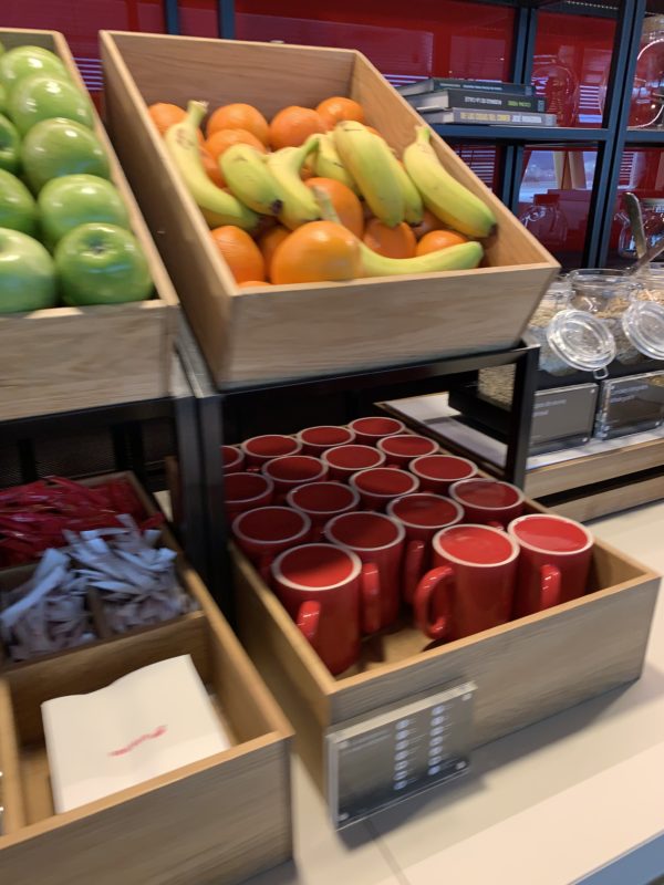 a group of boxes of fruit and cups