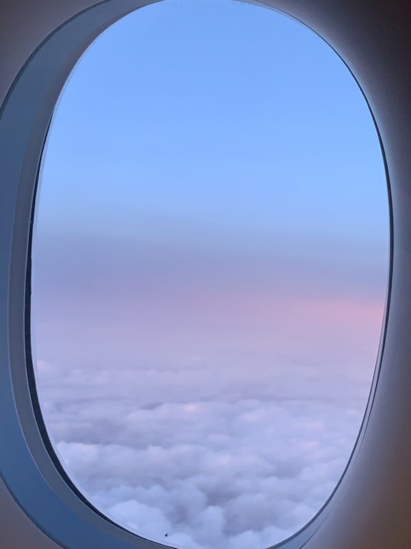 a window with clouds in the sky