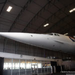 a white airplane in a hangar