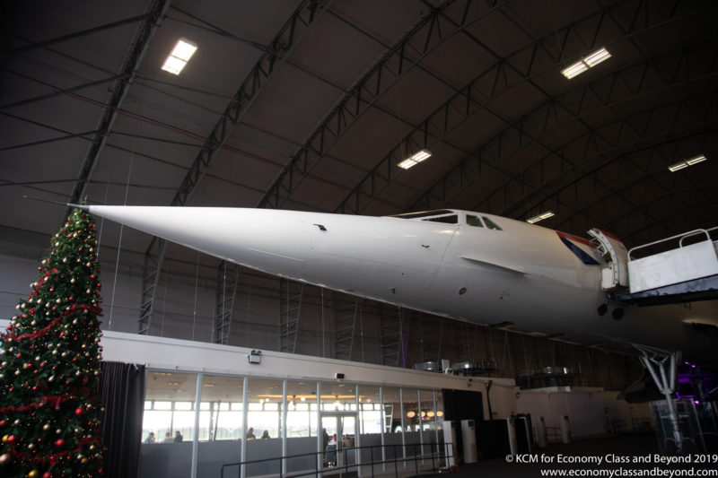 a white airplane in a hangar