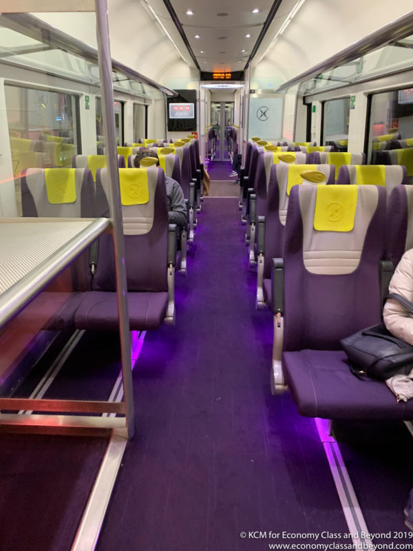inside a train with purple seats