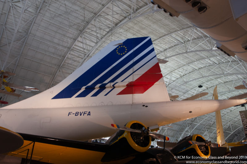a tail of a plane in a hangar