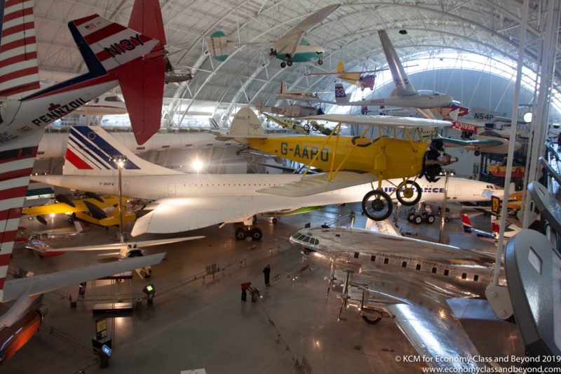 a group of airplanes in a hangar