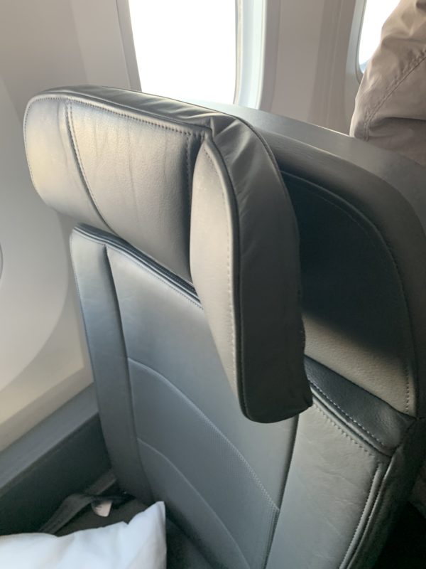 a black leather chair in an airplane