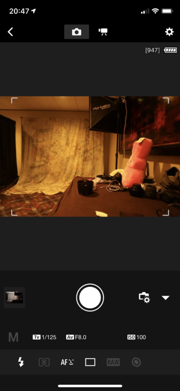 a screenshot of a room with a large curtain and a pink object