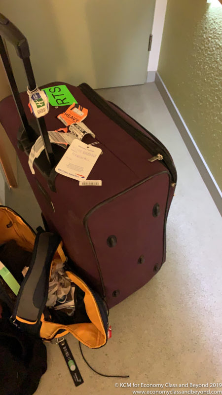a luggage bag with tags on it