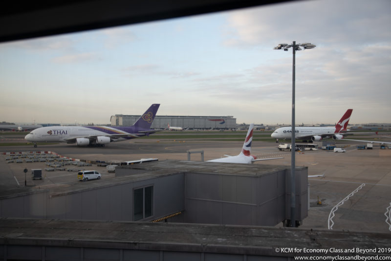 a group of airplanes at an airport