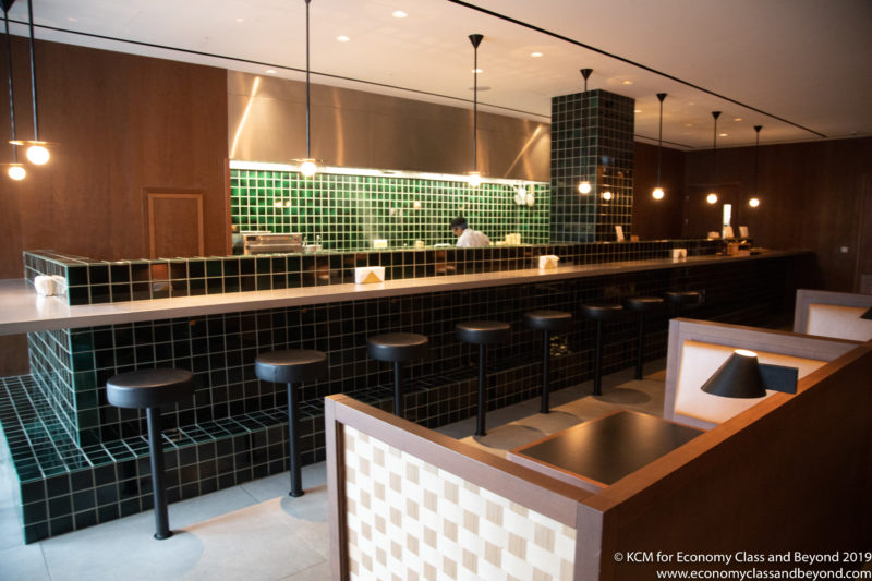 a bar with stools and a counter