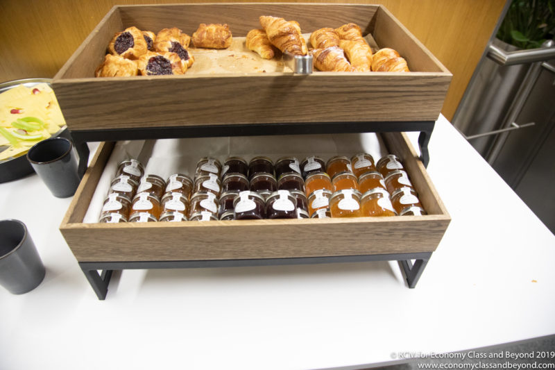 a tray of pastries and jams