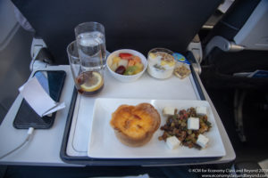 a tray with food and glasses on it
