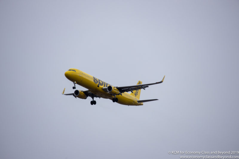 a yellow airplane in the sky