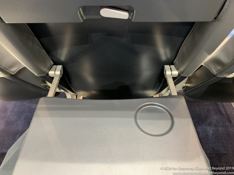 a seat with a grey object in the middle