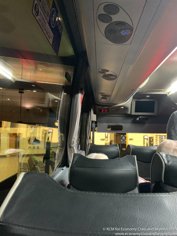 a bus with seats and a screen