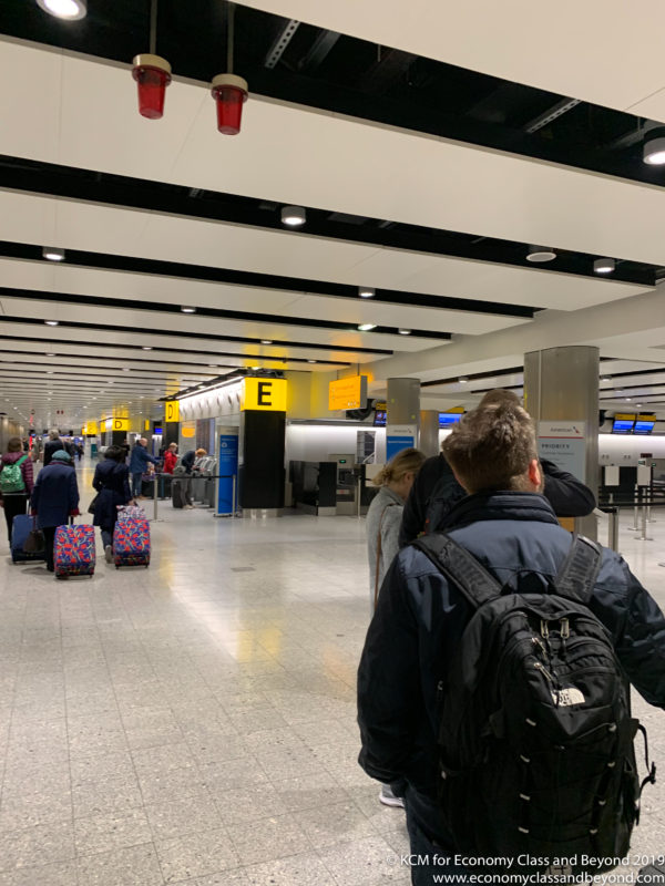 people in a terminal with luggage